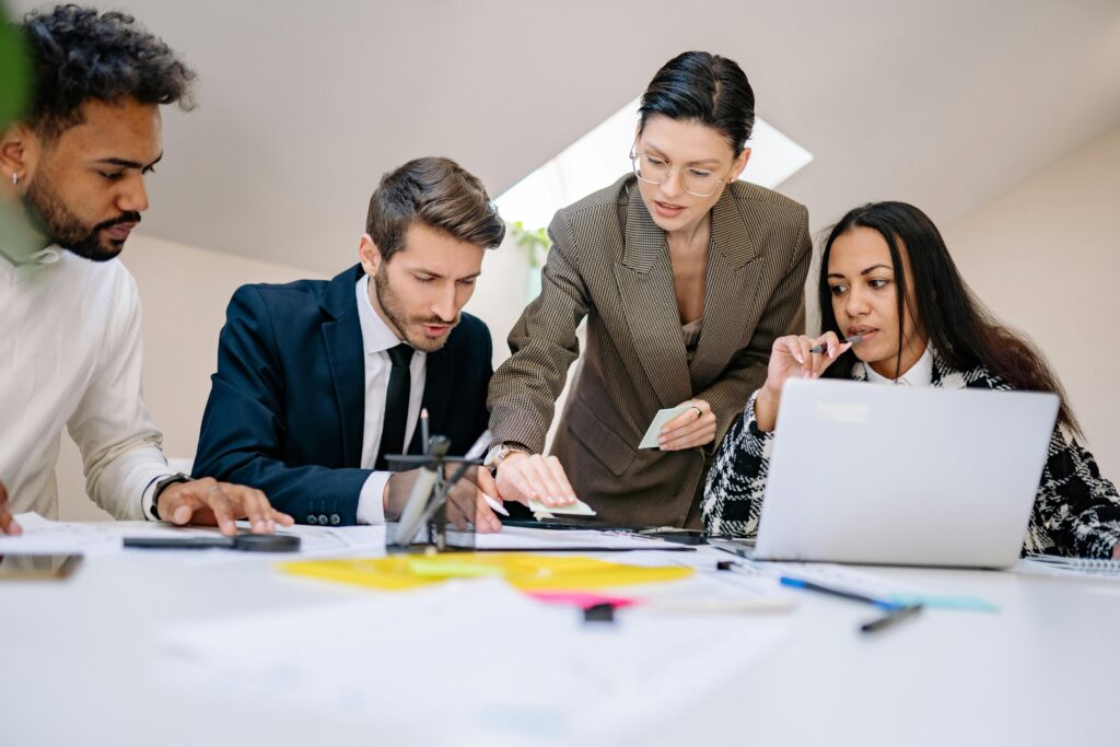 Business team of investors collaborating on a project during a meeting in a modern office.